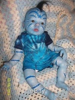 lifelike alien doll