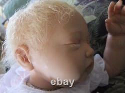 A Beautiful Reborn Baby Girl.in soft vinyl with fine blonde hair and eye lashes