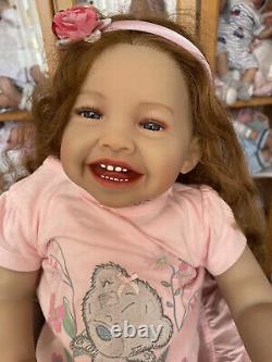 Adorable really sweet baby reborn toddler doll girl smiling Emma