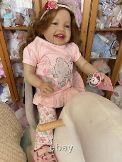 Adorable really sweet baby reborn toddler doll girl smiling Emma