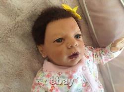 Beautiful Realborn mixed race reborn baby girl doll. Hand rooted hair. 19.5 ins