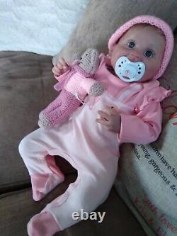 Happy cute little brown rooted head Reborn baby girl doll blue eyes
