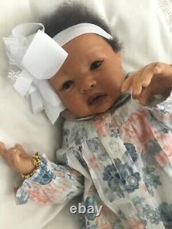 Lovely black, mixed race reborn baby girl doll. Hand rooted hair. 19 ins