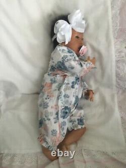 Lovely black, mixed race reborn baby girl doll. Hand rooted hair. 19 ins