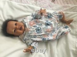 Lovely black, mixed race reborn baby girl doll. Hand rooted hair. 19 ins