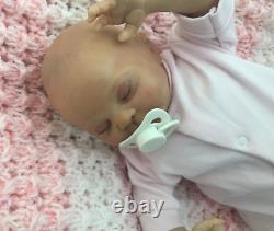 Lovely sleeping, reborn baby girl doll. Anatomically accurate fontanelle. 16 ins