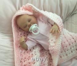 Lovely sleeping, reborn baby girl doll. Anatomically accurate fontanelle. 16 ins