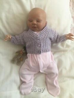 Lovely sleeping, reborn baby girl doll. Anatomically accurate fontanelle. 16 ins