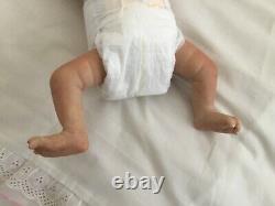 Lovely sleeping, reborn baby girl doll. Anatomically accurate fontanelle. 16 ins