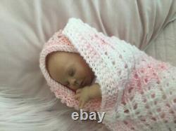 Lovely sleeping, reborn baby girl doll. Anatomically accurate fontanelle. 16 ins