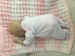 Lovely sleeping, reborn baby girl doll. Anatomically accurate fontanelle. 16 ins