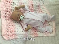 Lovely sleeping, reborn baby girl doll. Anatomically accurate fontanelle. 16 ins