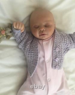 Lovely sleeping, reborn baby girl doll. Anatomically accurate fontanelle. 16 ins