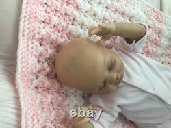 Lovely sleeping, reborn baby girl doll. Anatomically accurate fontanelle. 16 ins