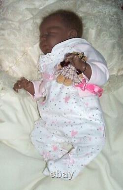 Lucy 15 ethnic reborn doll has rooted hair