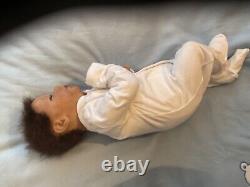 Reborn baby boy biracial doll. Sleeping eyes. Hand rooted Afro hair. 20 ins