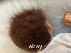 Reborn baby boy biracial doll. Sleeping eyes. Hand rooted Afro hair. 20 ins