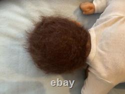 Reborn baby boy biracial doll. Sleeping eyes. Hand rooted Afro hair. 20 ins