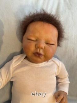 Reborn baby boy biracial doll. Sleeping eyes. Hand rooted Afro hair. 20 ins