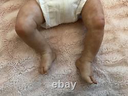 Reborn baby boy biracial doll. Sleeping eyes. Hand rooted Afro hair. 20 ins