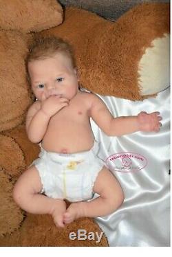 Solid silicone all body baby girl (reborn doll) Drink & wets diaper Glass eyes