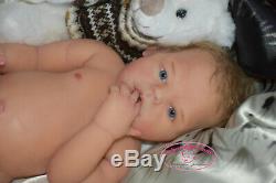 Solid silicone all body baby girl (reborn doll) Drink & wets diaper Glass eyes