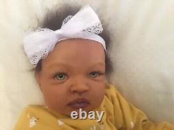 Stunning black, mixed race reborn baby girl doll. Hand rooted hair. 19 ins