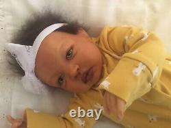 Stunning black, mixed race reborn baby girl doll. Hand rooted hair. 19 ins