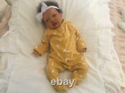 Stunning black, mixed race reborn baby girl doll. Hand rooted hair. 19 ins