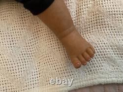 Stunning black reborn baby boy. 6 lbs. Black curly hand-rooted hair. 23 ins