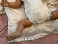 Stunning black reborn baby boy. 6 lbs. Black curly hand-rooted hair. 23 ins